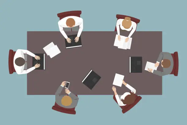 Vector illustration of Teamwork. Top view of employees working at table. Vector