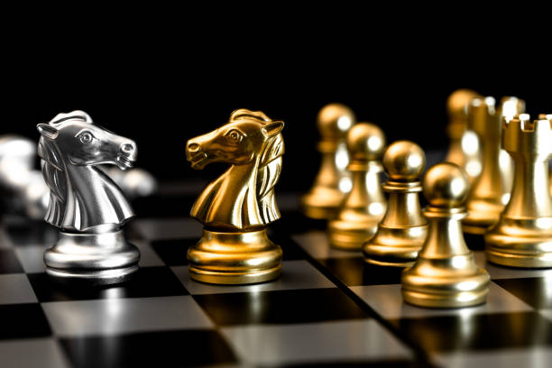 istock Chess piece represent business confront with competitor, Negotiations encounter people in market trade concept. 1194438459