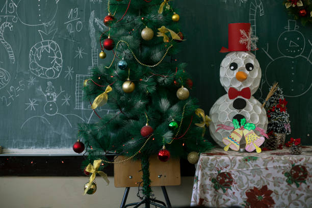 School Christmas tree and Snowman stock photo