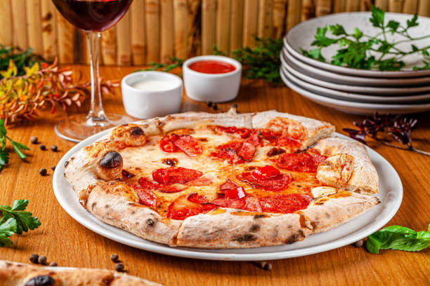 istock Italian food concept. Thin pizza with thick sides on a white plate. background image. copy space 1194442796