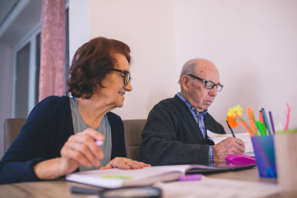 istock Senior couple checking their bills at home 1194443223