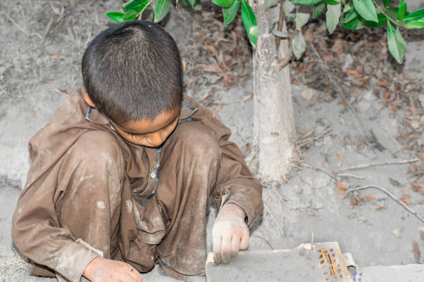 istock a young child is playing with a  toy on a muddy ground 1194444044
