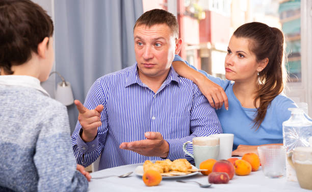istock Troubled parents reprimanding son 1194446030
