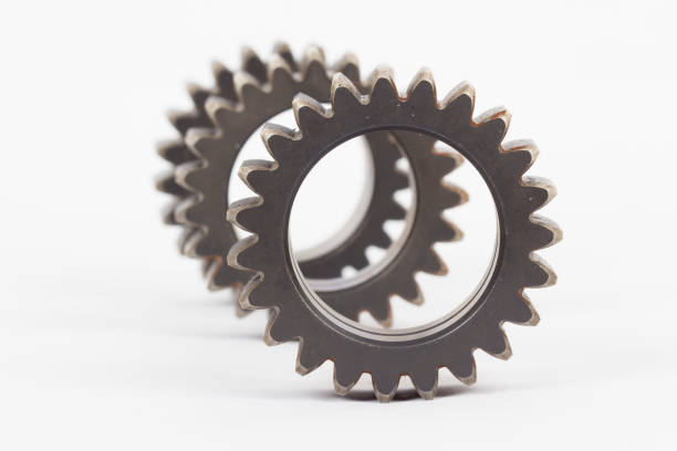 istock Small group of gears with their teeth engaged on a white background. 1194446577