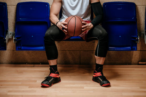 istock Basketball Player Holding a Ball 1194446824