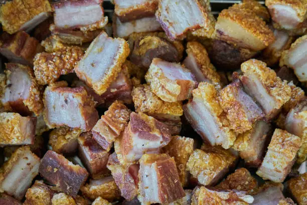 Photo of Torreznos dish cut into pieces and ready to eat. Torreznos are a typical meal from Soria, Spain, consisting of fried pork bacon.