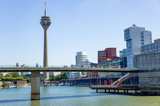 Dusseldorf, NRW, Germany - July 29, 2019: TV Tower in Mediahafen Dusseldorf and the river Rhein