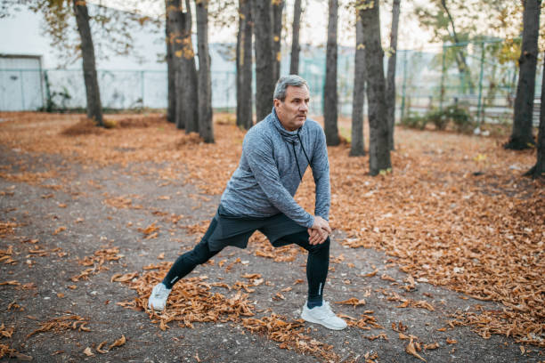 istock Senior man jogs into a public park 1194448566