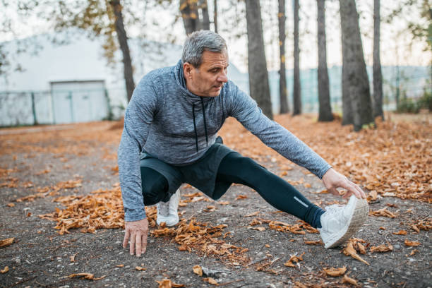 istock Senior man jogs into a public park 1194449307