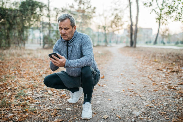 istock Senior man jogs into a public park 1194449309