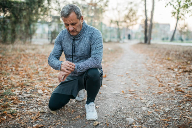 istock Senior man jogs into a public park 1194449317