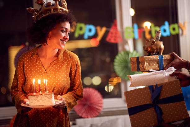 istock Birthday girl looking at gift 1194450085