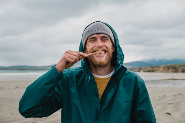 Cheerful Man Using Sustainable Toothbrush