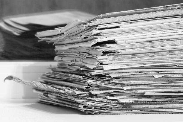 istock Newspapers Stacked in Pile 1194452754