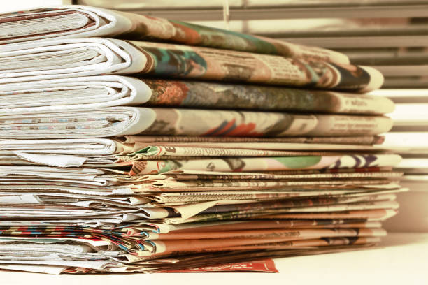 istock Newspapers Stacked in Pile 1194452830