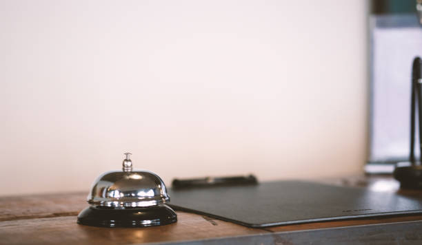 istock Hotel reception counter desk with service bell. 1194452968