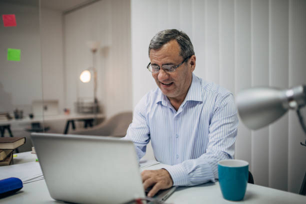 istock Senior businessman working in an office 1194453775