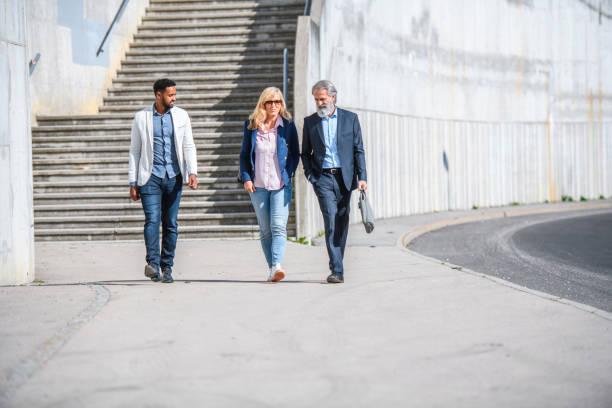 istock Relaxed Business Colleagues Walking Together 1194455105