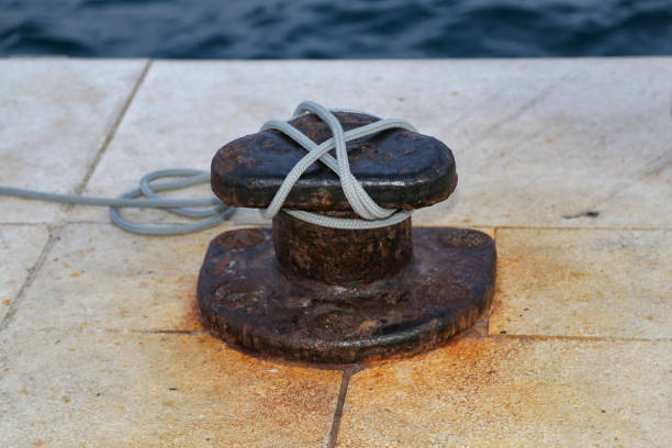 istock Bollard with a mooring line wrapped around it 1194455304