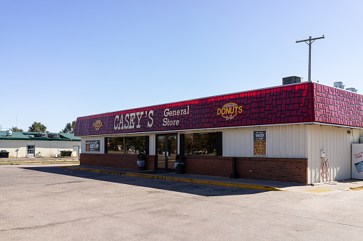 Larned, USA - October 14, 2019: Small town in Kansas with exterior of building for Casey's General Store and sign