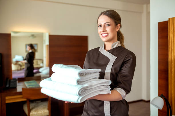 istock Cleaning maid bringing new towels 1194458501