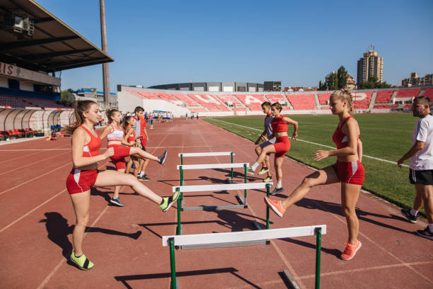 istock Athletics team training hurdling in pairs 1194459558
