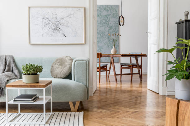 stylish scandinavian living room with design mint sofa, furnitures, mock up poster map, plants and elegant personal accessories. modern home decor. open space with dining room. template ready to use. - hotel room hotel bedroom picture frame imagens e fotografias de stock