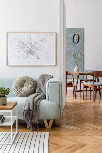 stylish scandinavian living room and dining room with design mint sofa, mock up poster map, plants and elegant personal accessories. modern home decor. open space. template. ready to use. - hotel room hotel bedroom picture frame imagens e fotografias de stock