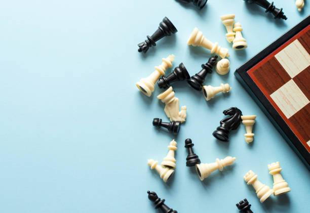 istock Chess near a chess board on blue background 1194460625