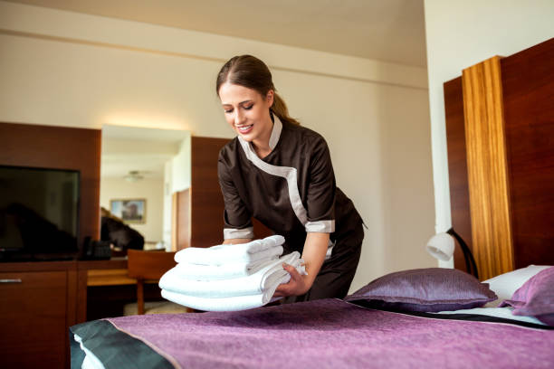 istock Room service maid bringing fresh new towels 1194461487