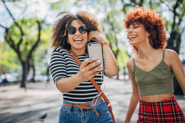 istock Two modern ladies in city 1194461858