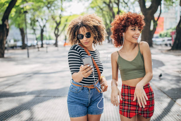 istock Two curly ladies in city 1194461877