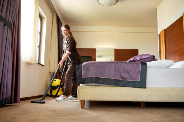 istock Hotel cleaning service maid vacuuming 1194463017