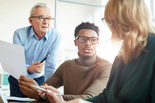 istock Business colleagues working in team 1194469163
