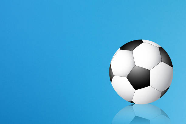 istock Soccer ball on blue background with copy space for text 1194472339