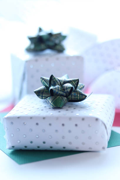istock white presents and plaid ribbon 1194474510