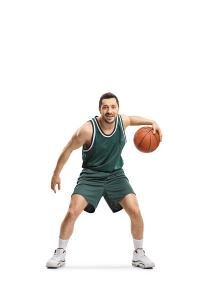 istock Man in green jersey playing basketball 1194475356