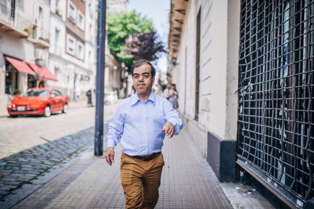 istock Gentleman walking on the street downtown 1194475617
