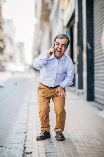 Photo of Little gentleman talking on mobile phone