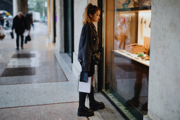 istock Young Asian woman window shopping 1194476898