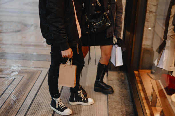 istock Young couple window shopping 1194477813