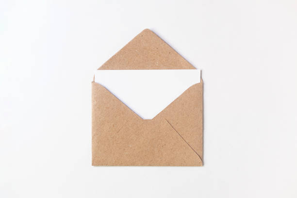 istock Craft paper envelope with blank letter isolated on white background. Mockup empty paper greeting card 1194478525