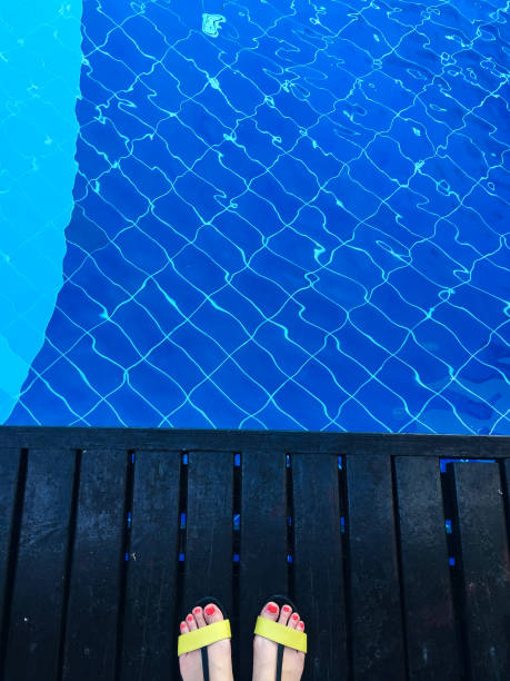 istock standing at swimming pool 1194478796