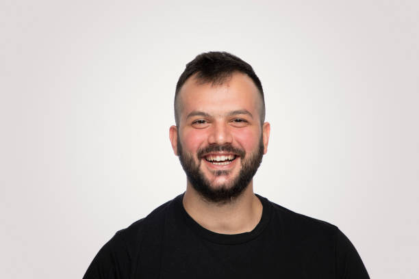 istock Laughing  handsome young man over isolated  gray background 1194481111