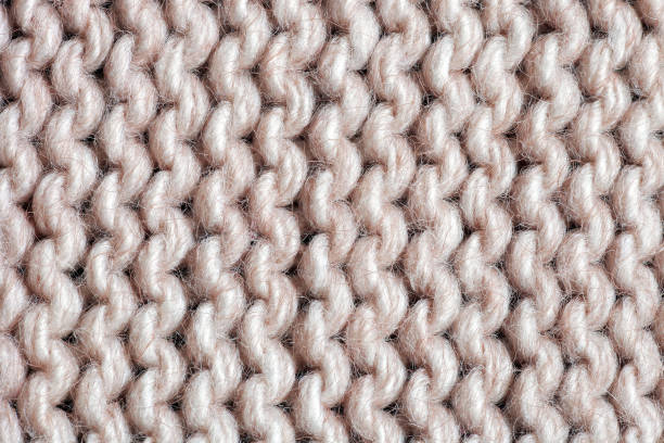 テクスチャベージュアクリルニットセーター。ガーターステッチ編みパターンクローズアップ - sewing close up pattern wool ストックフォトと画像