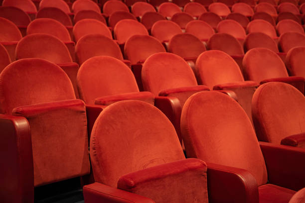 istock Empty comfortable red seats in the theatre/cinema 1194483468