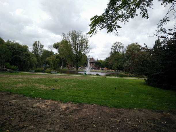 istock a park with a fountain in the middle 1194486137