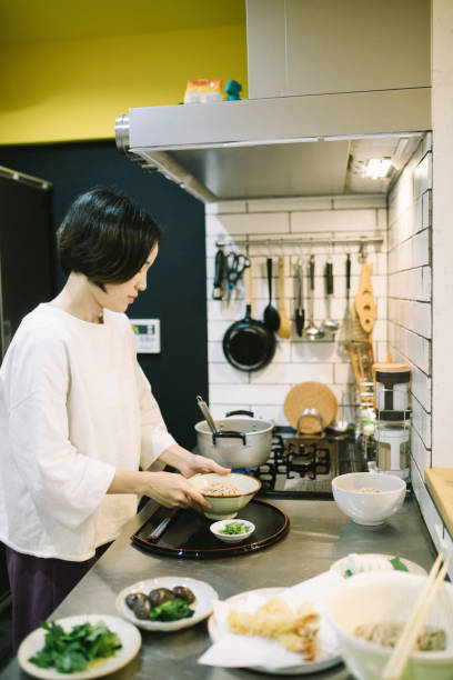 istock Asian Woman cooking in the kitchen 1194487689