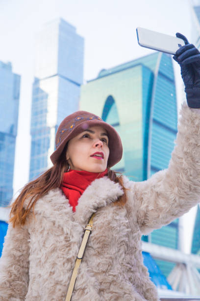 istock Woman taking selfie with highrise 1194488807