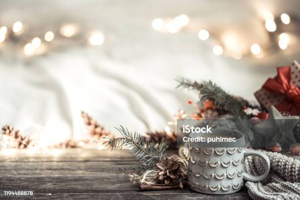 Festive Background With Cup On Wooden Background With Lights Stock Photo - Download Image Now